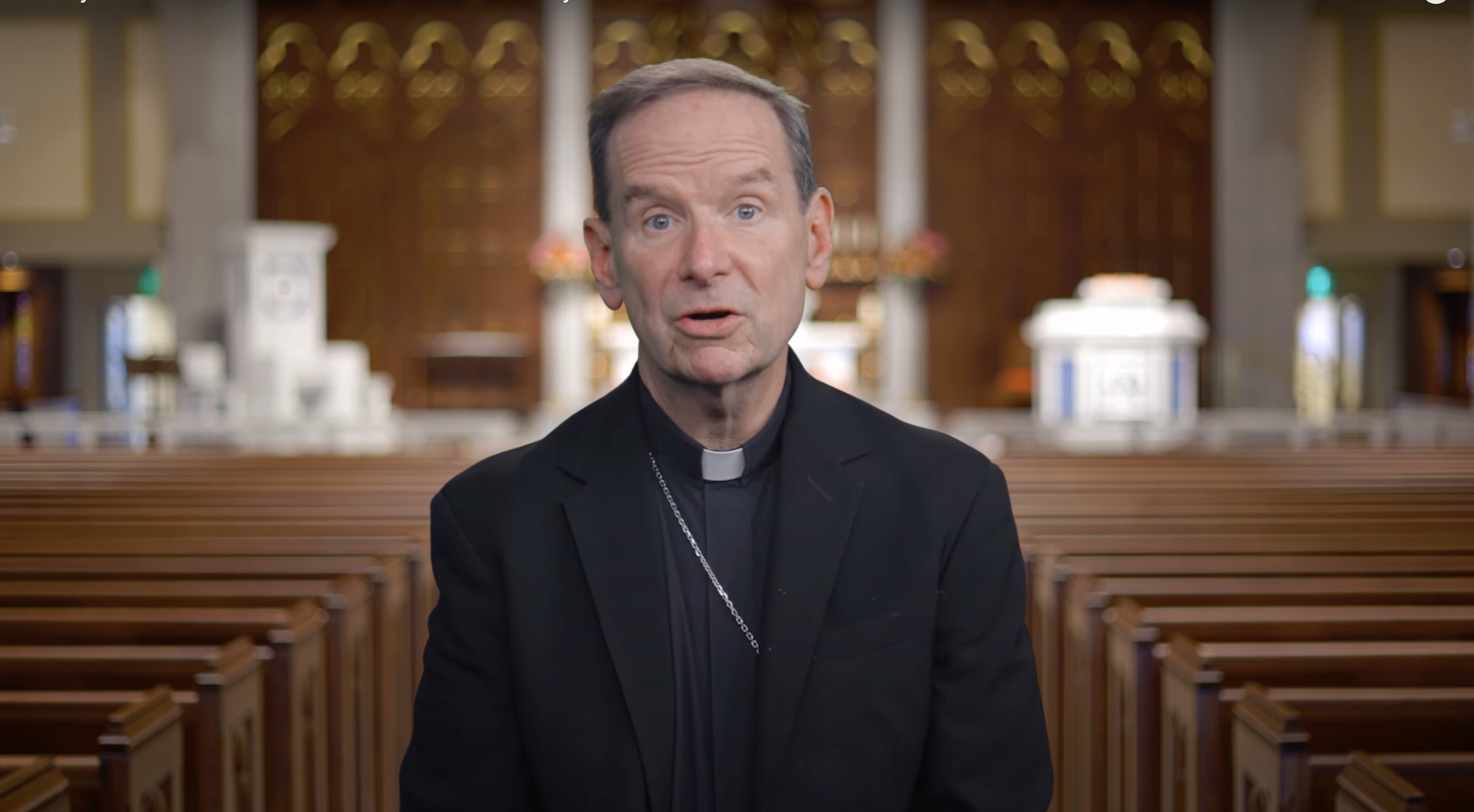 The Most Reverend Michael F. Burbidge, Bishop of the Diocese of Arlington, addresses the faithful from the cathedral