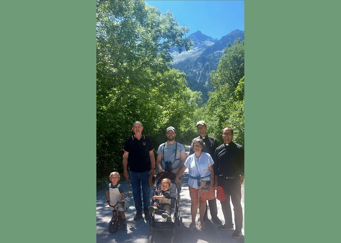 Fr. &Aacute;lvaro with DCJM priests and a parish family in the mountains